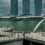 Singapore weather guide 2026 — heavy rain and thunderstorm over Singapore skyline, showing why accurate weather apps matter for planning