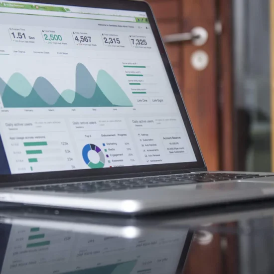 Marketer checking Google Ads campaign performance and cost on a laptop