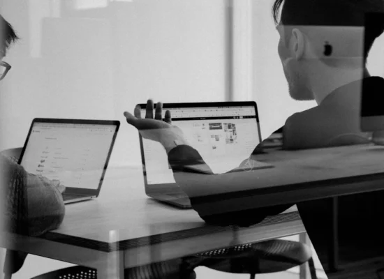 Marketer reviewing a LinkedIn document ad campaign on a laptop
