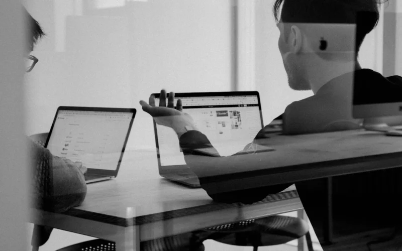 Marketer reviewing a LinkedIn document ad campaign on a laptop